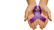 Two hands holding purple awareness ribbon, white background, top view, copy space on the left