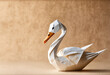 © Emily  - White origami swan duck on a plain background