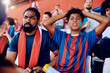 © Drazen - Black kid and his father displeased of their team losing match at stadium.