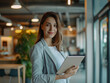 © Marco Attano - personal assistant wearing smart casual attire, holding a digital tablet, standing against the backdrop of a stylish, minimalist office interior, soft, ambient lighting enhancing the mood