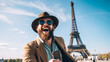 © Argun Stock Photos - Portrait of a handsome bearded man in sunglasses and a hat with a phone in the Eiffel Tower in Paris, France