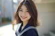 セーラー服を着た笑顔の日本人の女子高生（卒業・青春・高校生）