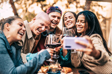 Group Of Young People Taking Selfie Picture Outdoor - Multiracial Friends Drinking And Toasting Red Wine Outside At Winery Farm - Life Style Concept With Guys And Girls Enjoying Summer Vacation