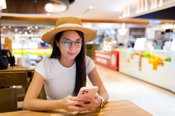 Sticker - Woman use of mobile phone in restaurant