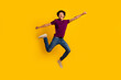 © deagreez - Full length photo of glad optimistic man wear trendy polo raise fist going fast crazy adventure isolated on yellow color background