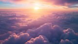 Fototapeta Niebo - Pink and orange clouds flying above the clouds at sunset or sunrise