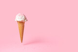 Fototapeta Miasto - summer funny creative concept of flying wafer cone with ice cream and strewed sprinkles on pink background
