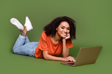 Canvas Print - Full length photo of shiny adorable lady dressed orange t-shirt communicating modern device isolated khaki color background