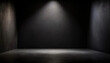 © Logo - A solitary spotlight shines on an empty black room, suitable for text mockup or product presentation.