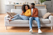 © Prostock-studio - Lovely African American Young Spouses Hugging At Modern Living Room