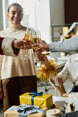 Poster - Happy young intercultural white collar workers with flutes of champagne toasting for new business during Christmas party in office
