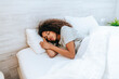 Portrait of woman sleeping in bed