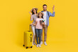 © Prostock-studio - Happy caucasian family with suitcases and travel documents posing on yellow background