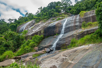 Poster - Waterfall in the Cachoeiras state park on the resort island of Ilhabela, São Paolo state, Brazil