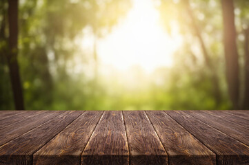 Wall Mural - Wooden table on window background with garden and trees