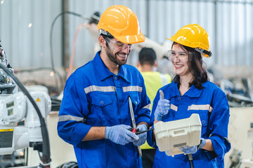 Wall Mural - professional technician engineer with safety working in industrial manufacturing factory, checking equipment of machinery production technology or construction operating workshop maintenance service