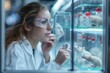 A curious scientist in a pristine lab coat gazes intently through her goggles at the tiny rats in the glass case, her reflection appearing in the transparent material as she studies the intricate wor