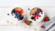Two healthy breakfast bowl with ingredients granola fruits Greek yogurt and berries top view. Weight loss, healthy lifestyle and eating concept