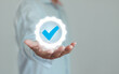 © THAWEERAT - Hand shows the sign of the top service Quality assurance, ISO certification and standardization concept. Standard quality control certification guarantee. Business service value proposal warranty.