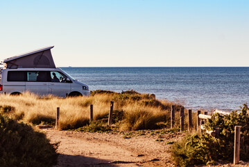 Poster - Camper van with roof top tent camp on beach