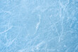 © Andrii - Icy background on rink with visible traces of skating, showcasing the essence of winter sport. Texture of ice on skating rink visible from top view, displaying sheet of scratched ice.
