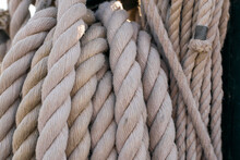 Close-up Image Showcases The Complex Texture And Sturdy Braiding Of Thick Nautical Ropes, Reflecting A Long-standing Maritime Heritage.