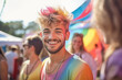 © Oliver Evans Studio - young smiling guy at a summer music festival, dyed hair glitter dust bearded concert happy rock party colorful beautiful joyful sun rainbow crowd youth outdoors enjoying entertainement fun