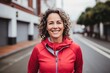 © NikoG - Portrait of a smiling middle aged caucasian woman in sport clothing in the city