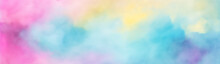 Colorful Pastel Background. Abstract Watercolor Sunset Sky With Fluffy Clouds In Bright Pink, Green, Blue, Yellow, And Purple Rainbow Colors. Wide Banner With Copy Space For Text.