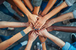 A top view of a group of friends stacking their hands together, Community of people stacking hands together - Multiracial people putting their hands on top of each other 
