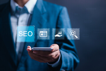 Wall Mural - seo concept, businessman use smartphone with virtual seo icons to analyze seo search engine optimiza