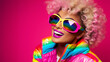 © ZaStock - colorful hair girl wearing ultra bright disco clothes and sunglasses on pink background. Party