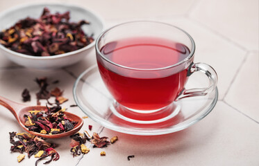 Wall Mural - Glass cup of hot hibiscus tea.