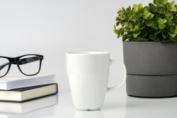 Wall Mural - Coffee mug on white office table mock up