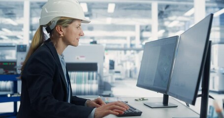 Fototapete - Caucasian Female Industrial Engineer Developing 3D Prototype of a Circuit Motherboard on a Desktop Computer In the Electronics Factory Office. Modern Technological Research and Development Center.