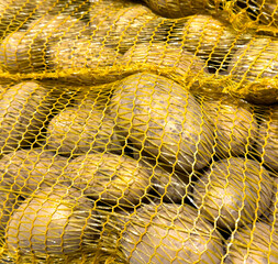 Poster - Potatoes on the market counter. Background