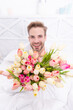 © be free - glad romantic man with march tulips flowers. romantic man with tulips for 8 march.