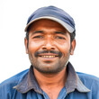 © Graphic Master - Close-up of a confident Indian man driver smiling on a white background, exuding positivity and professionalism