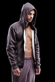 Fototapeta Tęcza - Fashion, body and fitness man in studio with hoodie, jacket or gym, clothes or style choice on black background. Exercise, chest or profile of confident male model with comfortable workout outfit
