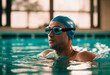 © Anton Dios - Portrait of a male swimmer wearing goggles and cap in swimming pool