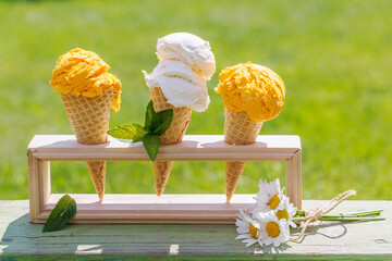 Refreshing ice cream in waffle cones with lemon flavour