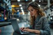 © sirisakboakaew - Businesswoman in modern factory using laptop