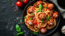 Food Photography Concept : Spaghetti With Tomato Sauce And Meatballs In A Bowl On Black Stone Background
