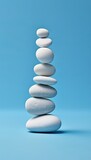 Fototapeta Desenie - Zen stone stack on isolated blue background. Perfect balance concept.
