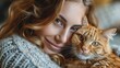 © Amonthep - young woman holding cute cat with green eyes. Female hugging her cute long hair kitty. Background