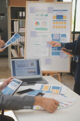 Close up ux developer and ui designer use augmented reality brainstorming about mobile app interface wireframe design on desk at modern office.Creative digital development agency