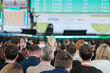 © Anton Gvozdikov - Blurred view of an attentive audience listening to a speaker at a professional conference event.