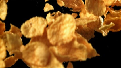 Sticker - Corn flakes falling on black background. Filmed on a high-speed camera at 1000 fps. High quality FullHD footage