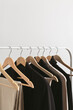 Modern rack with capsule collection in neutral black and beige colours.