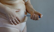 Woman making Semaglutide Injection Pen in her Stomach. Semaglutide Injection Diabetes Drug Being Used For Weight Loss.